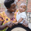 Abihuta Cooperative artisan with her child