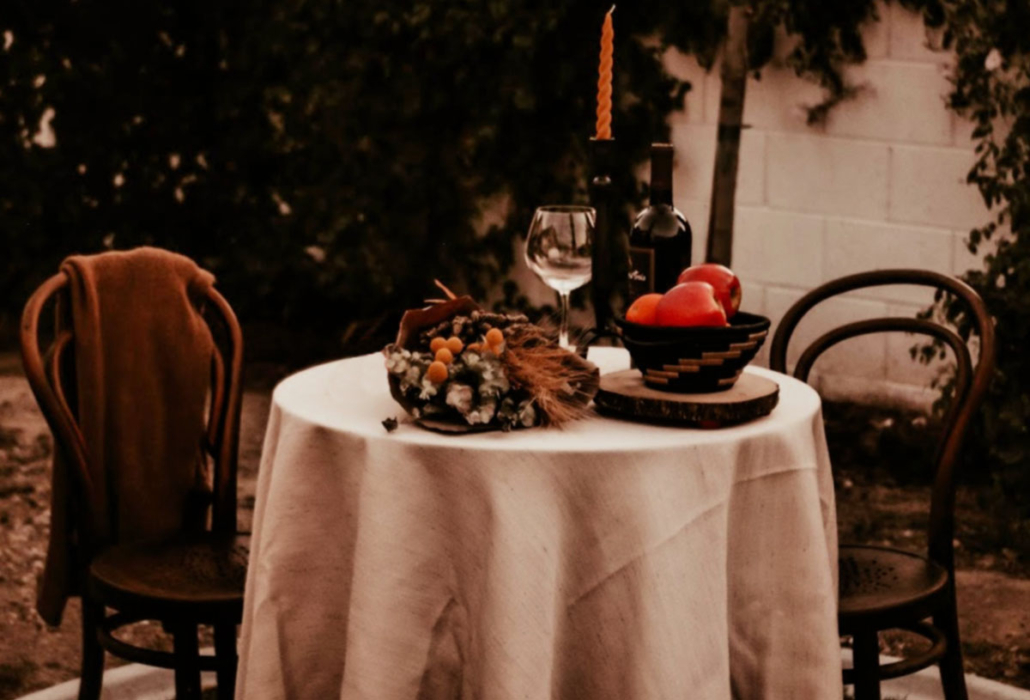 Becka Bella Style styled table featuring Azizi Life woven pot and twisted candle